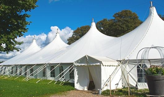 a line of sleek and modern portable restrooms ready for use at an upscale corporate event in Dobbs Ferry