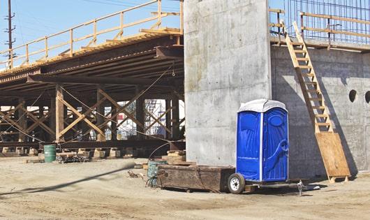 rows of porta potties at a work site, providing essential amenities for workers